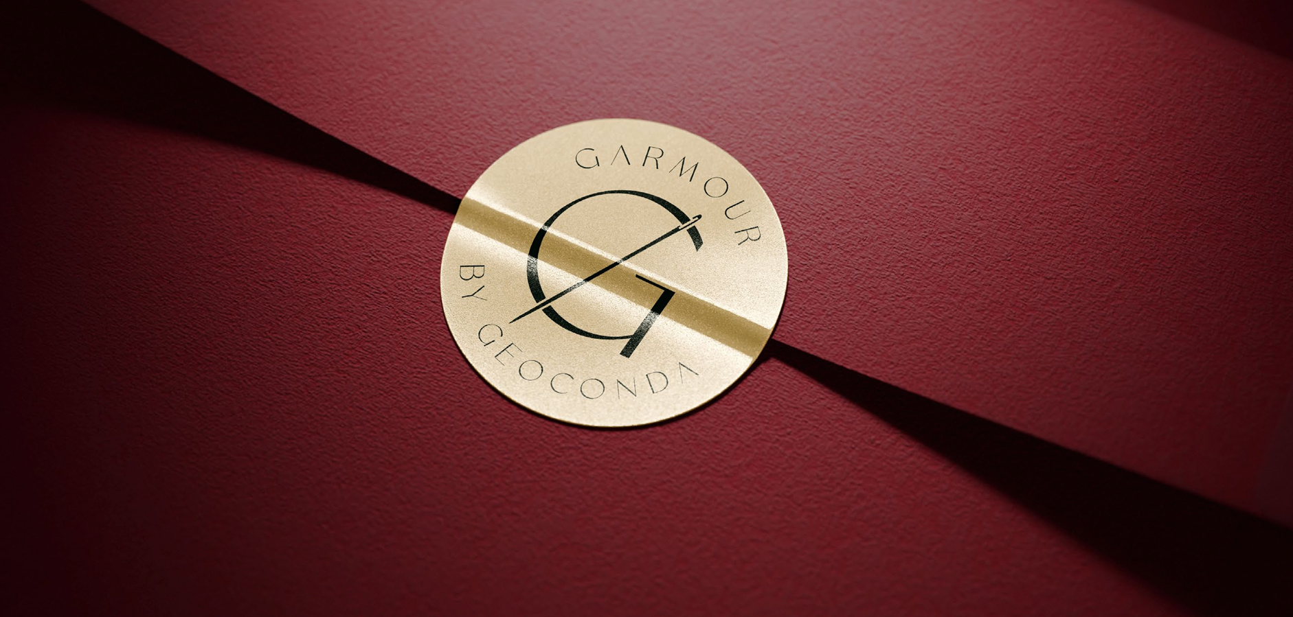 Gold seal with Garmour by Geoconda logo on burgundy envelope